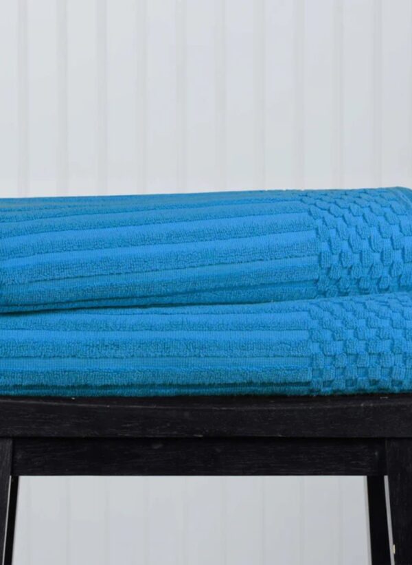 Two-piece bath towel set made of cotton with a ribbed texture, designed for ultra-absorbency. The towels are soft, durable, and feature a classic, simple style, perfect for everyday use
