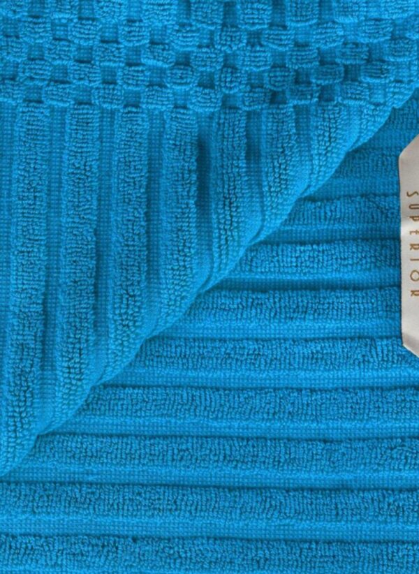 Two-piece bath towel set made of cotton with a ribbed texture, designed for ultra-absorbency. The towels are soft, durable, and feature a classic, simple style, perfect for everyday use